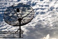 Satellite dishes communication technology network with sun and white cloud in background Royalty Free Stock Photo