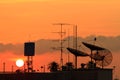 Satellite dishes over sunset Royalty Free Stock Photo