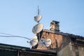 satellite dishes on the roofs, increasingly rapid communications and pay TV without advertising Royalty Free Stock Photo