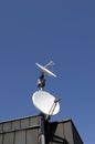 Satellite dishes on rooftop Royalty Free Stock Photo