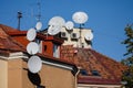 Satellite dishes and TV antennas on the roof Royalty Free Stock Photo