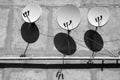 Satellite dishes on the wall of the house. Royalty Free Stock Photo