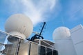 Satellite domes and communication antennas on the upper deck of a cruise ship. Royalty Free Stock Photo