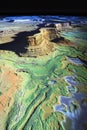 Satellite GIS scan of a desert plateau with LiDAR data rendering elevation dunes and natural formations.