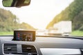 Satellite navigation system device in car with blurred transportation Royalty Free Stock Photo