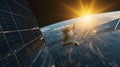 Satellite orbiting Earth with sun rising behind it. Royalty Free Stock Photo