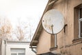 Satellite television dish at the facade of the building Royalty Free Stock Photo