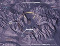 Satellite view of land, war operations, sci-fi, night vision with blue hues. Military target. Drone flying over an area. Hud Royalty Free Stock Photo