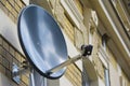 Satellite dish at a house wall Royalty Free Stock Photo