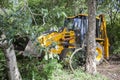 Sathyamangalam, Tamil Nadu, India - June 24, 2015: An excavator is seen parked among trees in the Sathyamangalam forest