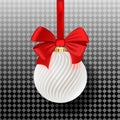 Satin bauble with white stripes hanging on a gold ribbon with red bow isolated on transparent. Royalty Free Stock Photo