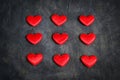 Satin red hearts on a dark background. Valentine`s Day card. Royalty Free Stock Photo