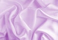 Satin silk fabric purple color for the background. Crumpled wavy silk. Texture of satin fabric