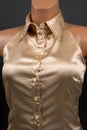 Satin and silk women shirt with mother-of-pearl buttons on a dark background. Style and fashion in clothes. Textile industry