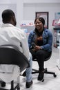 Satisfied african american customer buying pills in drugstore