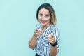 Satisfied attractive joyful adult woman pointing to camera with fingers, choosing you, making choice Royalty Free Stock Photo