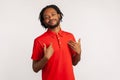 Satisfied bearded man wearing red casual style T-shirt, pointing finger at himself feeling proud and ambitious, boasting Royalty Free Stock Photo