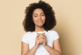 Satisfied beautiful African American girl holding paper cup coffee Royalty Free Stock Photo