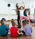 satisfied boys and girls rehearsing ballet dance in studio Royalty Free Stock Photo