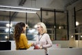 Satisfied business ladies shaking hands