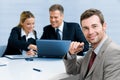 Satisfied businessman with colleagues Royalty Free Stock Photo