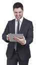 Satisfied businessman holding tablet