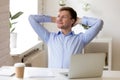 Satisfied businessman relaxing leaning back, enjoying break at w Royalty Free Stock Photo