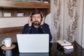 Satisfied businessman wearing headphones enjoying music at home Royalty Free Stock Photo