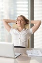 Satisfied businesswoman leaning back in chair Royalty Free Stock Photo