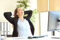 Satisfied businesswoman relaxing at office