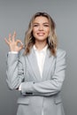 Satisfied client female showing ok sign. Young confident businesswoman hold okay finger gesture Royalty Free Stock Photo