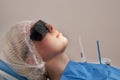 Woman patient at the dentist smiling and waiting to be checked up