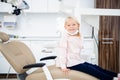 Satisfied dentistry patient showing her perfect smile after treatment in a clinic Royalty Free Stock Photo