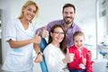 Satisfied family with a smiling young female dentist Royalty Free Stock Photo