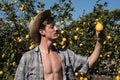 Satisfied farmer watch a lemon