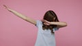Girl shows internet meme of triumph, performs dabbing trends