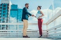 Satisfied male greeting with happy girl outdoor Royalty Free Stock Photo