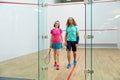 Satisfied man and woman athlete after successful squash game