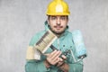 A satisfied painter has a big problem with the choice of tools for work Royalty Free Stock Photo