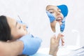 Satisfied patient at the dentist. who demonstrates his perfect smile after treatment