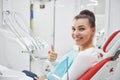 Satisfied patient showing her perfect smile after treatment in a dentist clinic Royalty Free Stock Photo