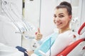 Satisfied patient showing her perfect smile after treatment in a dentist clinic Royalty Free Stock Photo