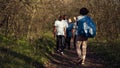 Satisfied people leaving the woods after a productive litter cleanup session