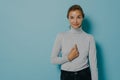 Satisfied pleased woman points at herself being chosen receives great news