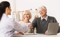 Satisfied Senior Couple Making Sale Purchase Deal Royalty Free Stock Photo