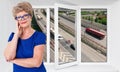 Satisfied senior woman standing near new triple-casement pvc window with loudy Royalty Free Stock Photo