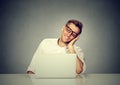 Satisfied with work done man sitting in front of laptop computer