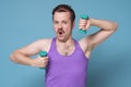 Satisfied young strength man lifting dumbbell isolated on white background Royalty Free Stock Photo