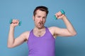 Satisfied young strength retro man lifting dumbbell Royalty Free Stock Photo