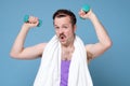 Satisfied young strength retro man lifting dumbbell Royalty Free Stock Photo